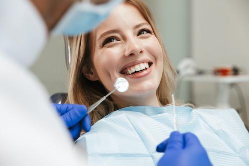 A woman smiling to the dentist before getting a Root Canal Treatment in Pampa, TX
