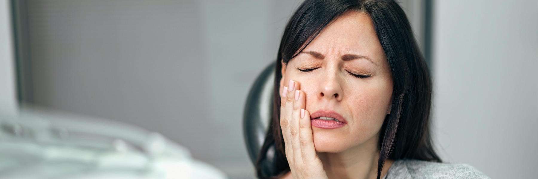 A woman in pain before getting a Root Canal Treatment in Pampa, TX